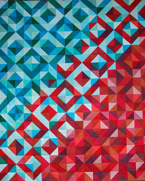 a colorful icon showing a quilt pattern